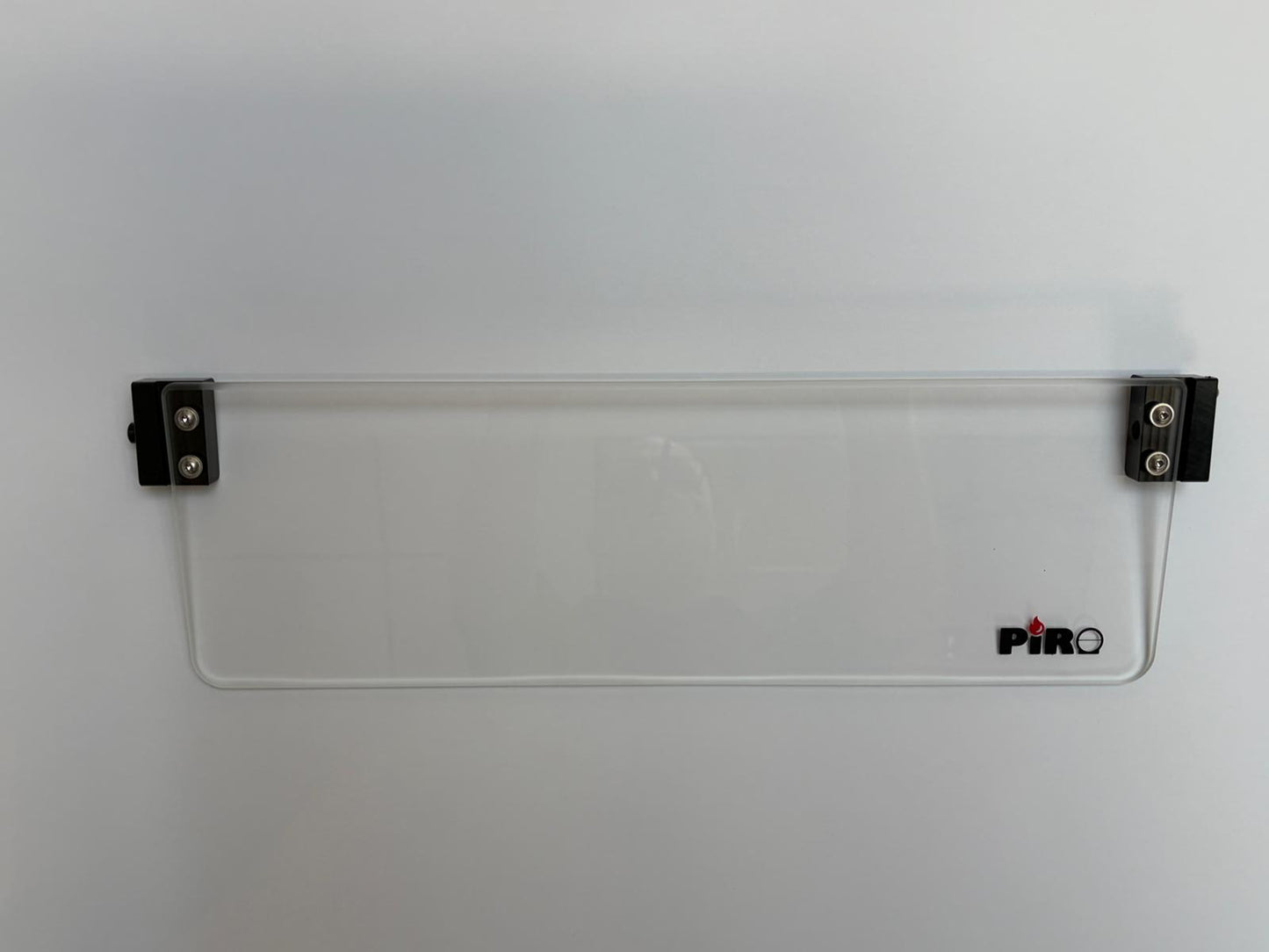 Clear glass window with metal clips on a white background